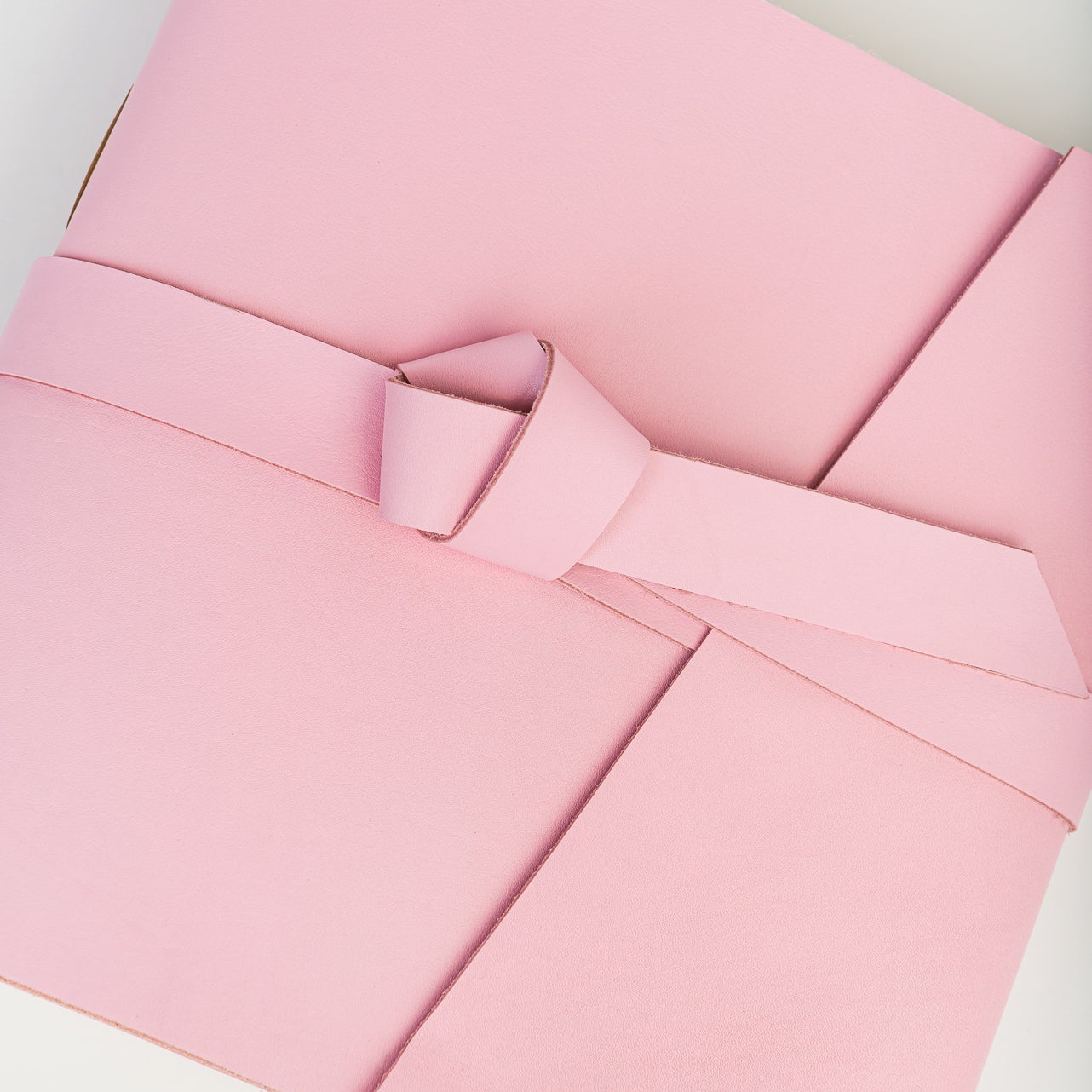A light pink leather photo album