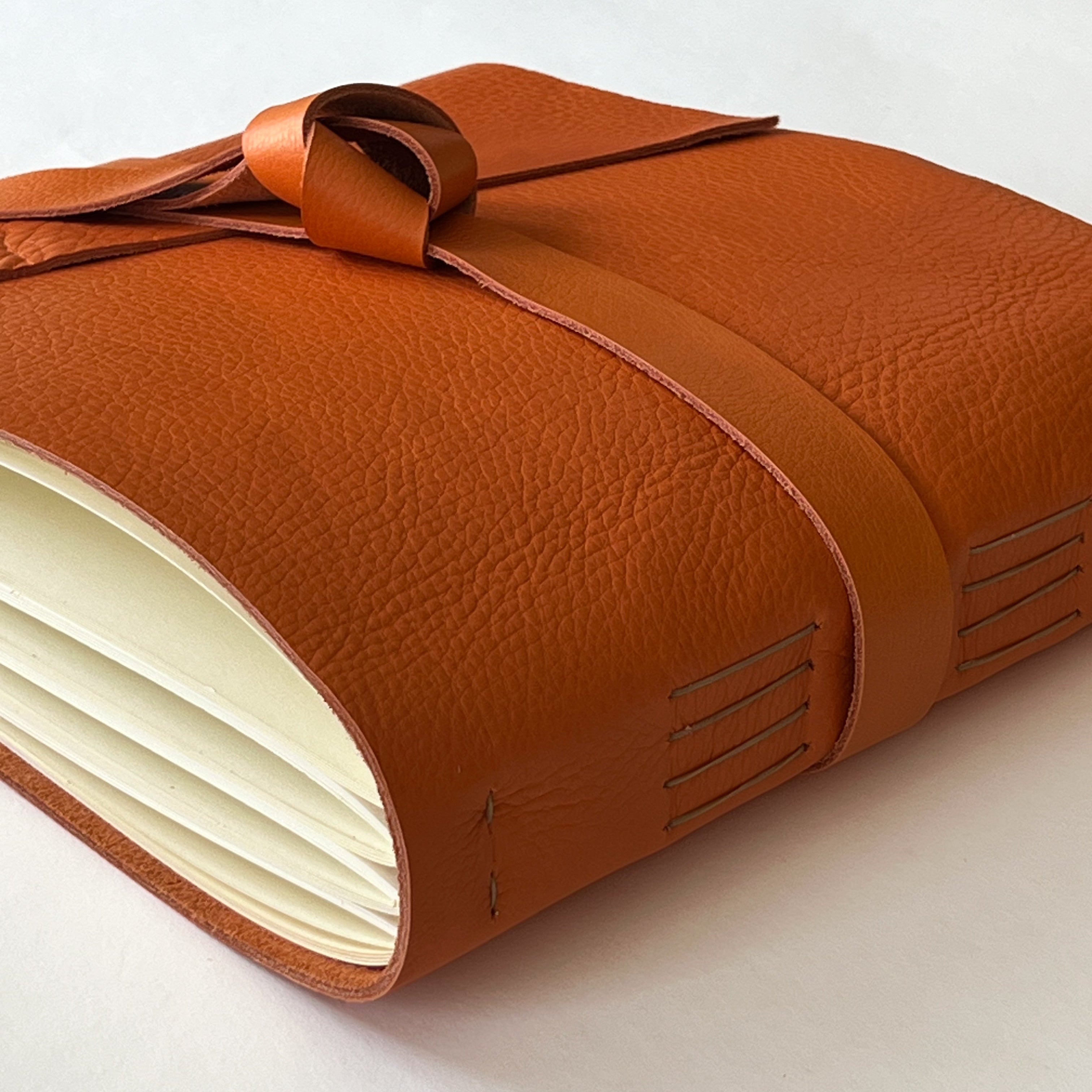orange handmade leather photo album with custom engraving