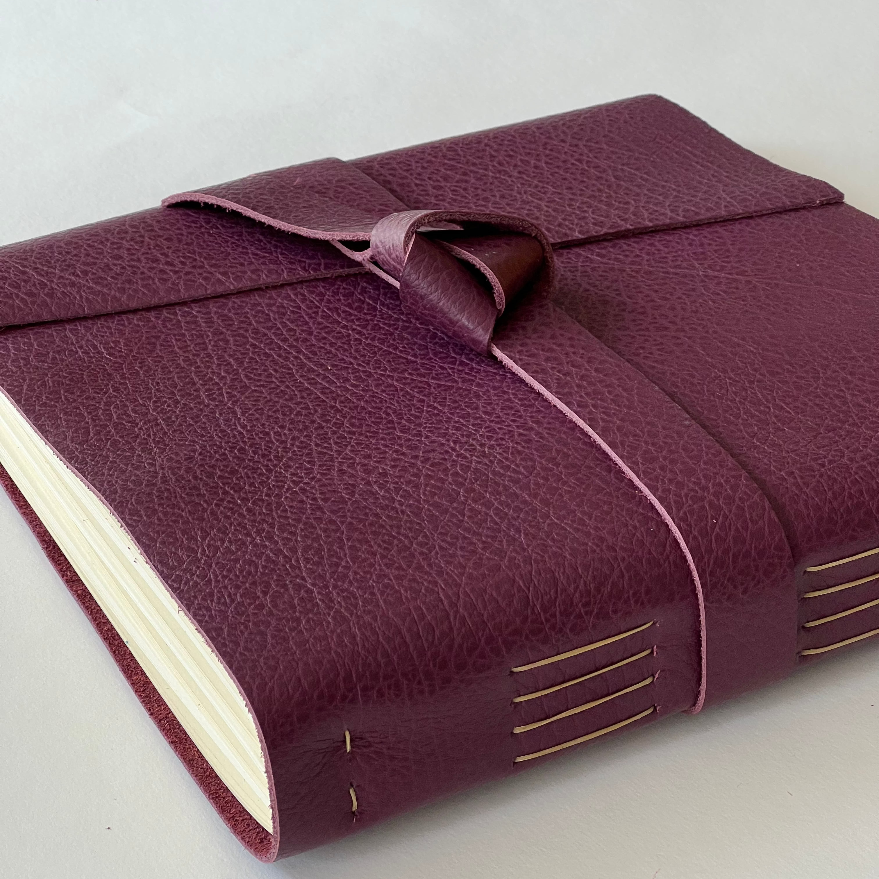 plum leather handmade photo album with custom engraving